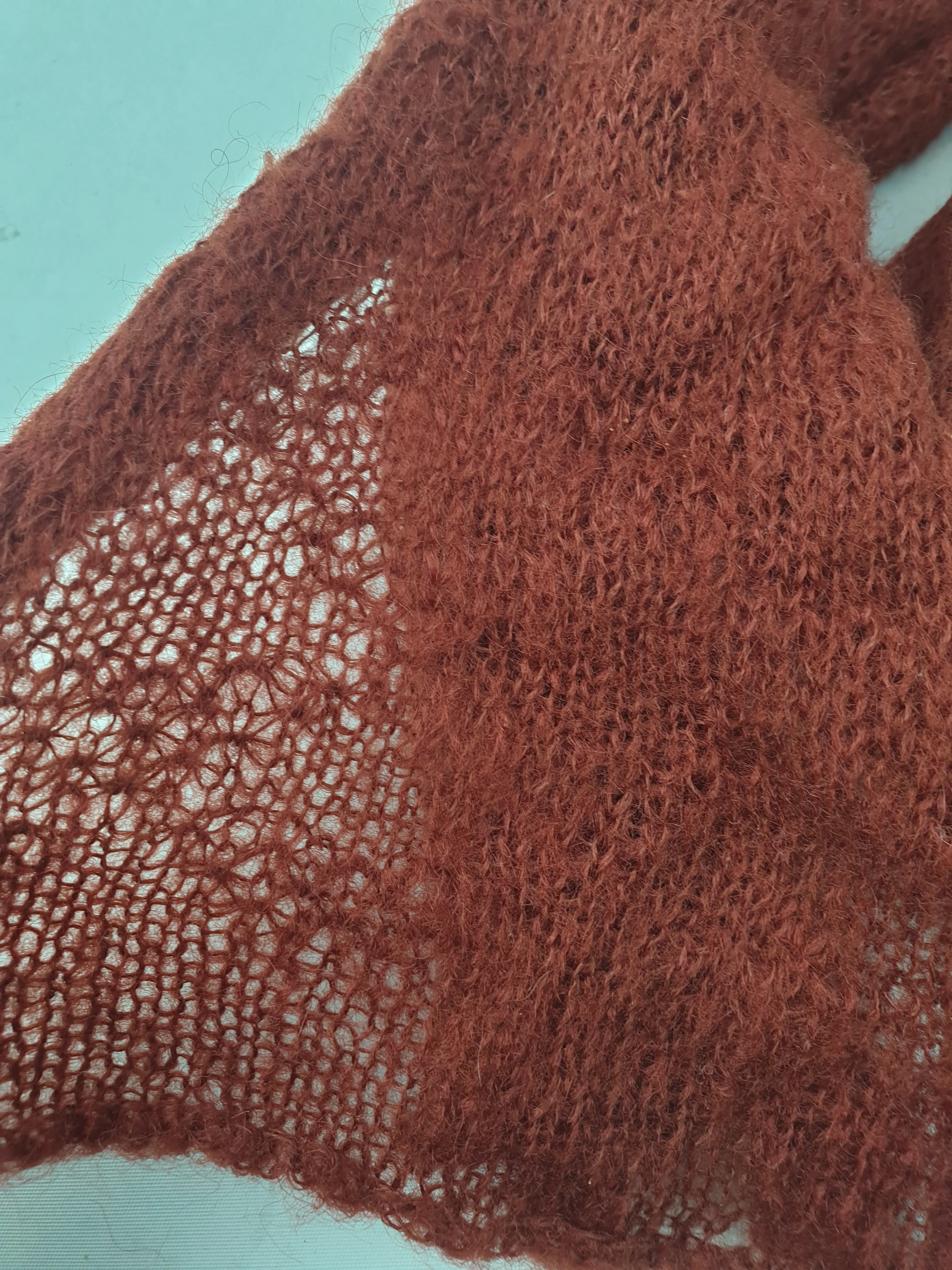 Deep red wool knit thin scarf with beautiful knitt pattern