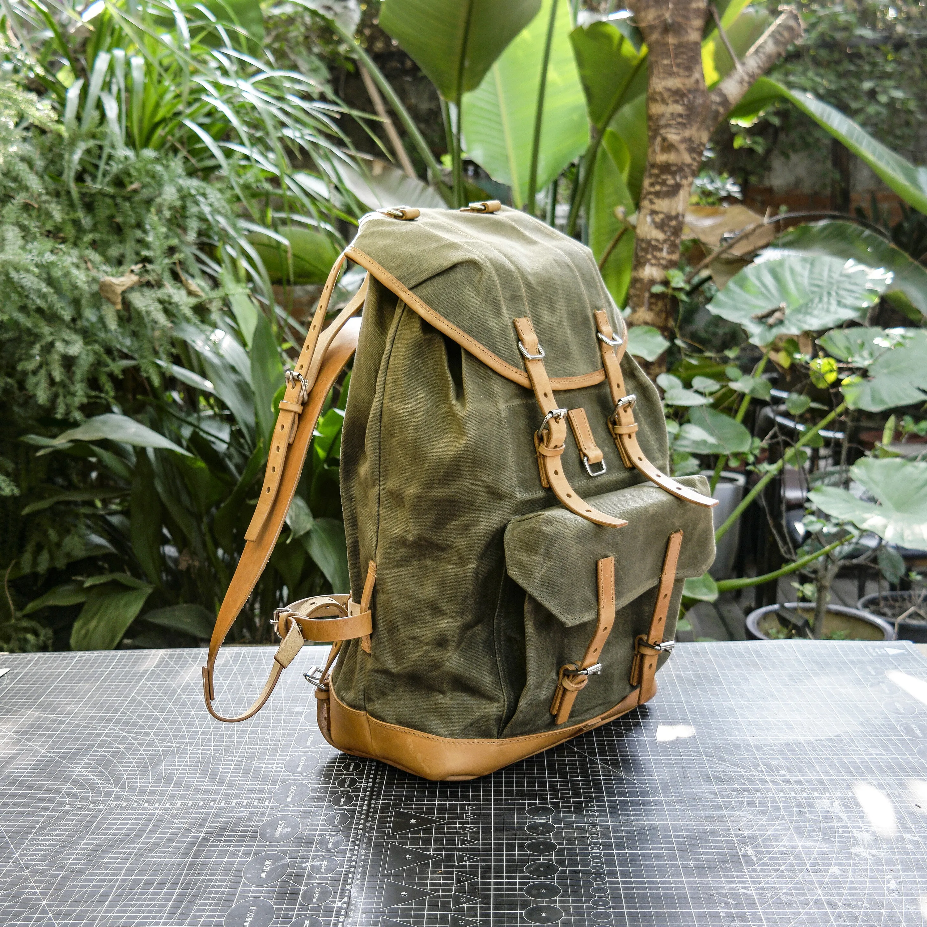 Swiss adventure vintage plant blend cowhide waxed canvas jungle hiking camping handmade backpack