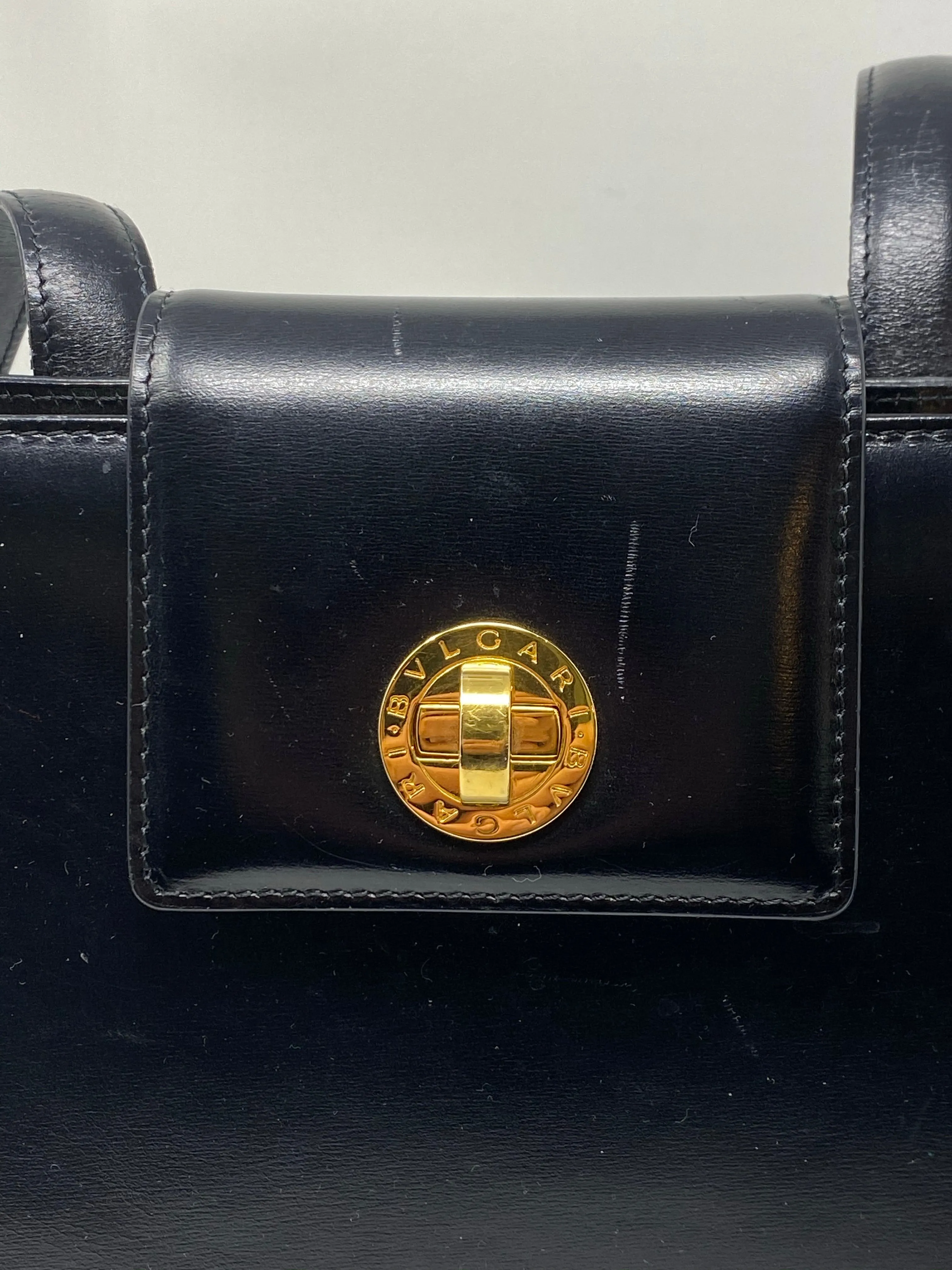 Vintage: BVLGARI black leather single flap Shoulder bag with gold closure and turn lock